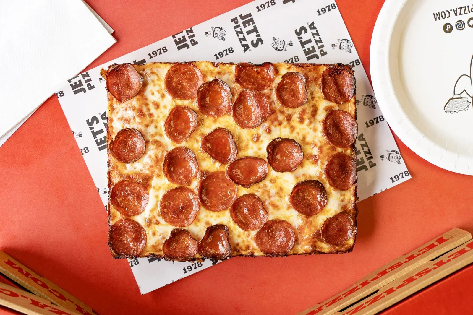 Jet's Pizza pepperoni pizza on branded paper