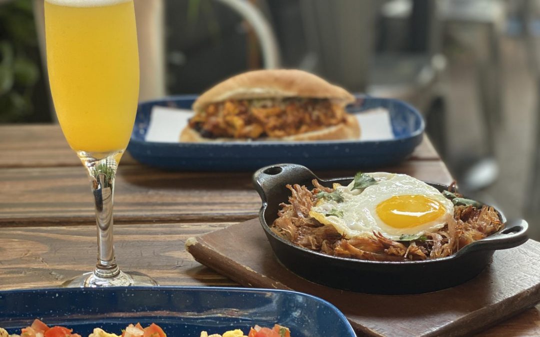 mimosa and breakfast spread on table in Chicago